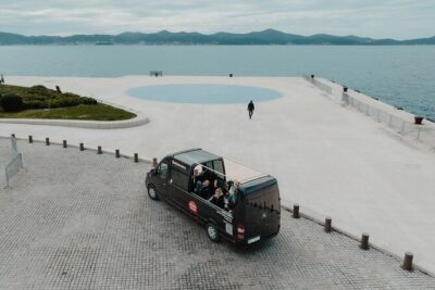 Experience Zadar Cabrio Guided Tour from Cruise Port - Park Vruljica to Oštri Rat: Neighborhood energy and a calmer coastline