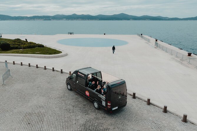Experience Zadar Cabrio Guided Tour from Cruise Port - Park Vruljica to Oštri Rat: Neighborhood energy and a calmer coastline