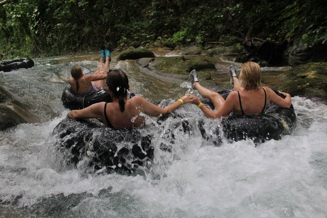 Falmouth Shore Excursion: Dunns River Falls and River Tubing Tour - The top of the falls: views, market browsing, and a massage-parlor break